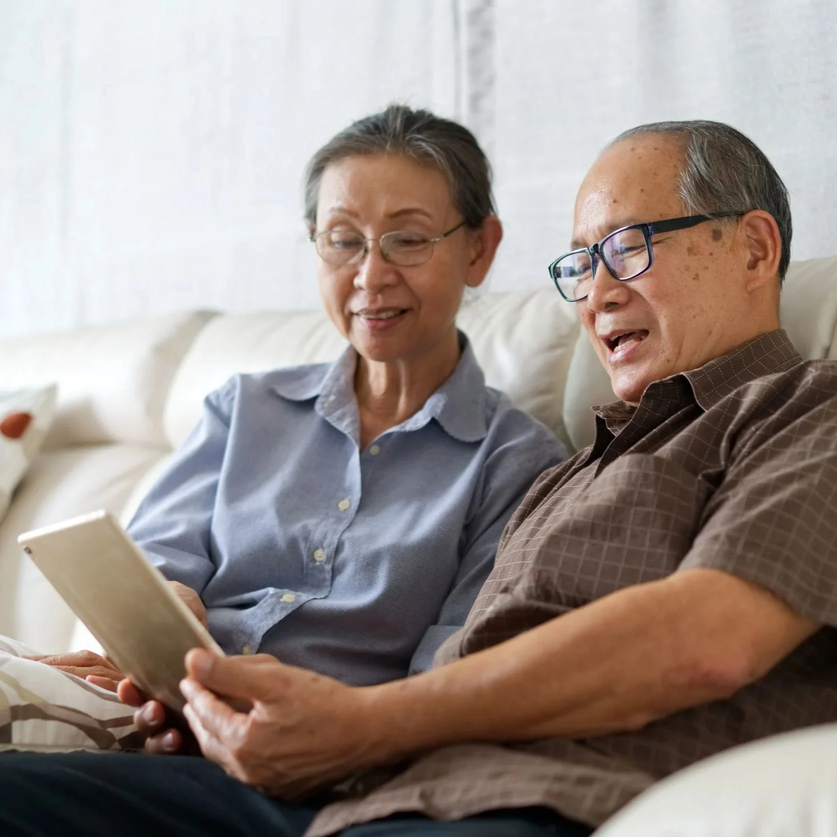 Older couple looking at IPad together